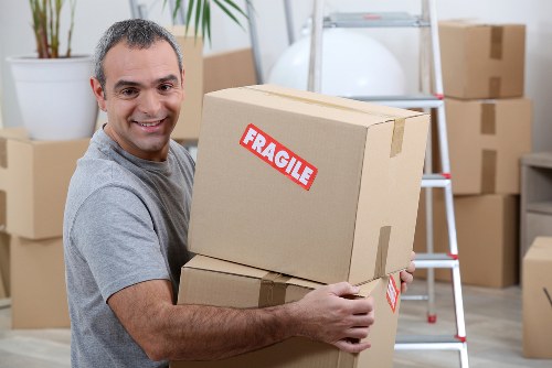Moving team handling furniture during a scheduled booking