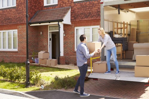 Man and van loading furniture for a home move in Gants Hill