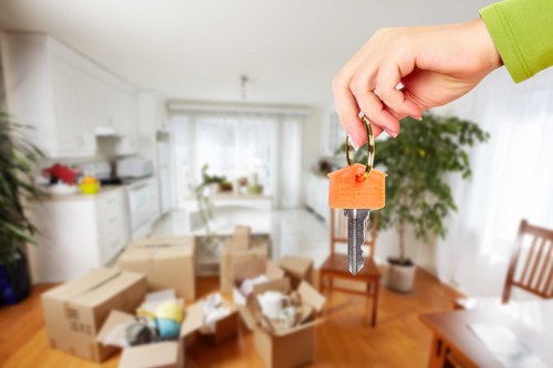 Careful moving team handling boxes and furniture