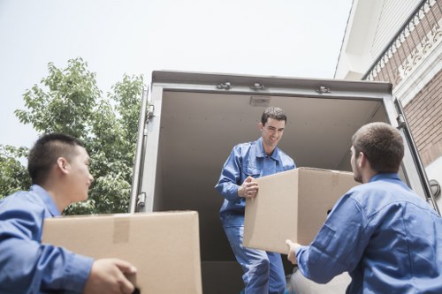 Packed moving boxes and furniture ready for transport