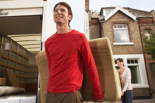 Packed moving boxes and furniture for a local home relocation in Gants Hill