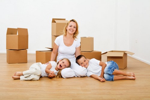House removal team handling stairs and furniture in Gants Hill