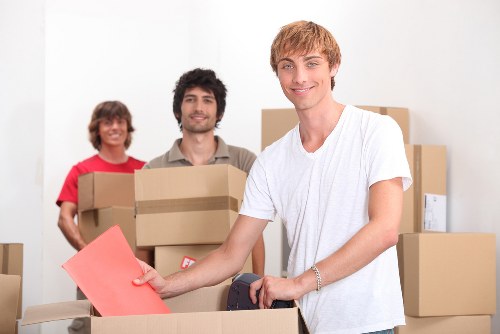Home moving team handling furniture and boxes in Gants Hill