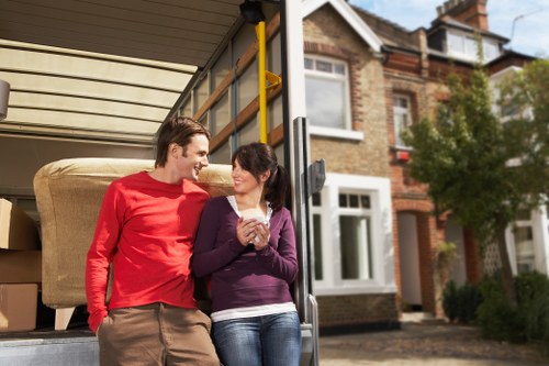 Careful furniture handling during a house removal in Gants Hill