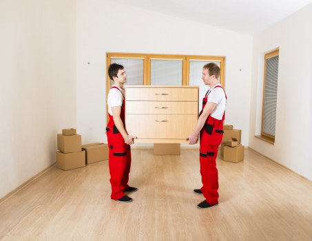 Preparing boxes and furniture for a moving truck in Gants Hill